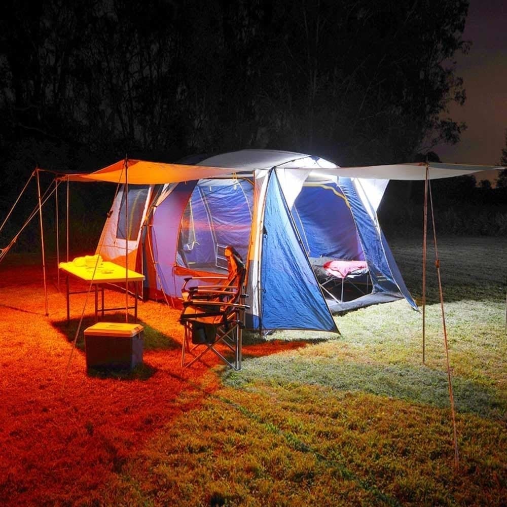 Illuminated camping tent at night showcasing portable power solution